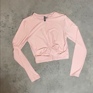 Long sleeve pink crop top with twisted knot